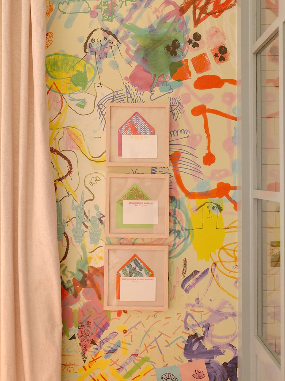 art hanging against bold wallpaper