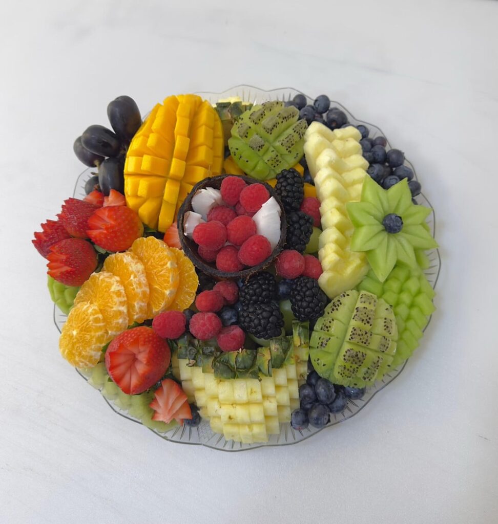 [Pro/Chef] My job is to prepare, cut, and arrange fresh fruit in dishes, towers, or fruit sticks.