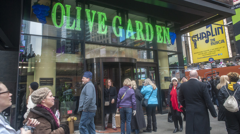 Customers wait outside the Olive Garden times square location