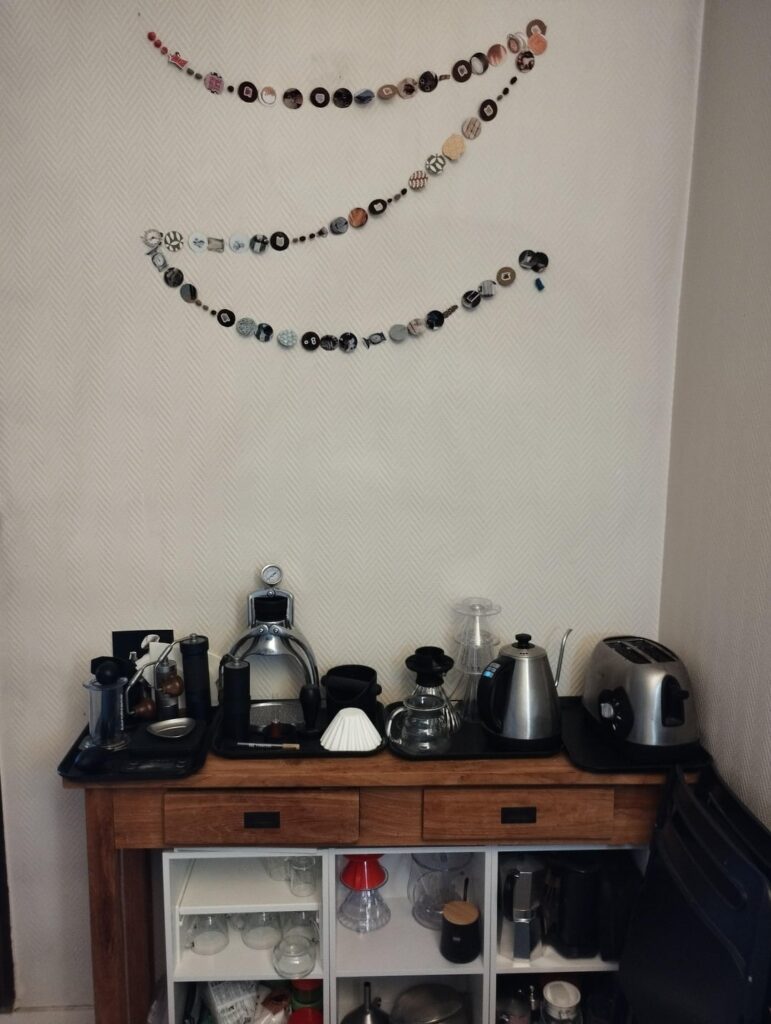 Hand-made coffee themed garland (with coffee beans and cherries, and a tiny AeroPress model at the end) hanged up above my coffee station 🎄