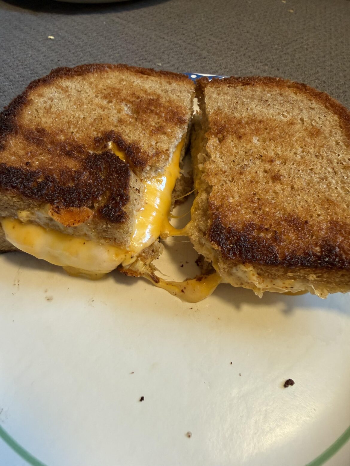 My bread machine light rye, local salted butter, sliced American and Colby/Jack, Slap ya mama Cajun spice