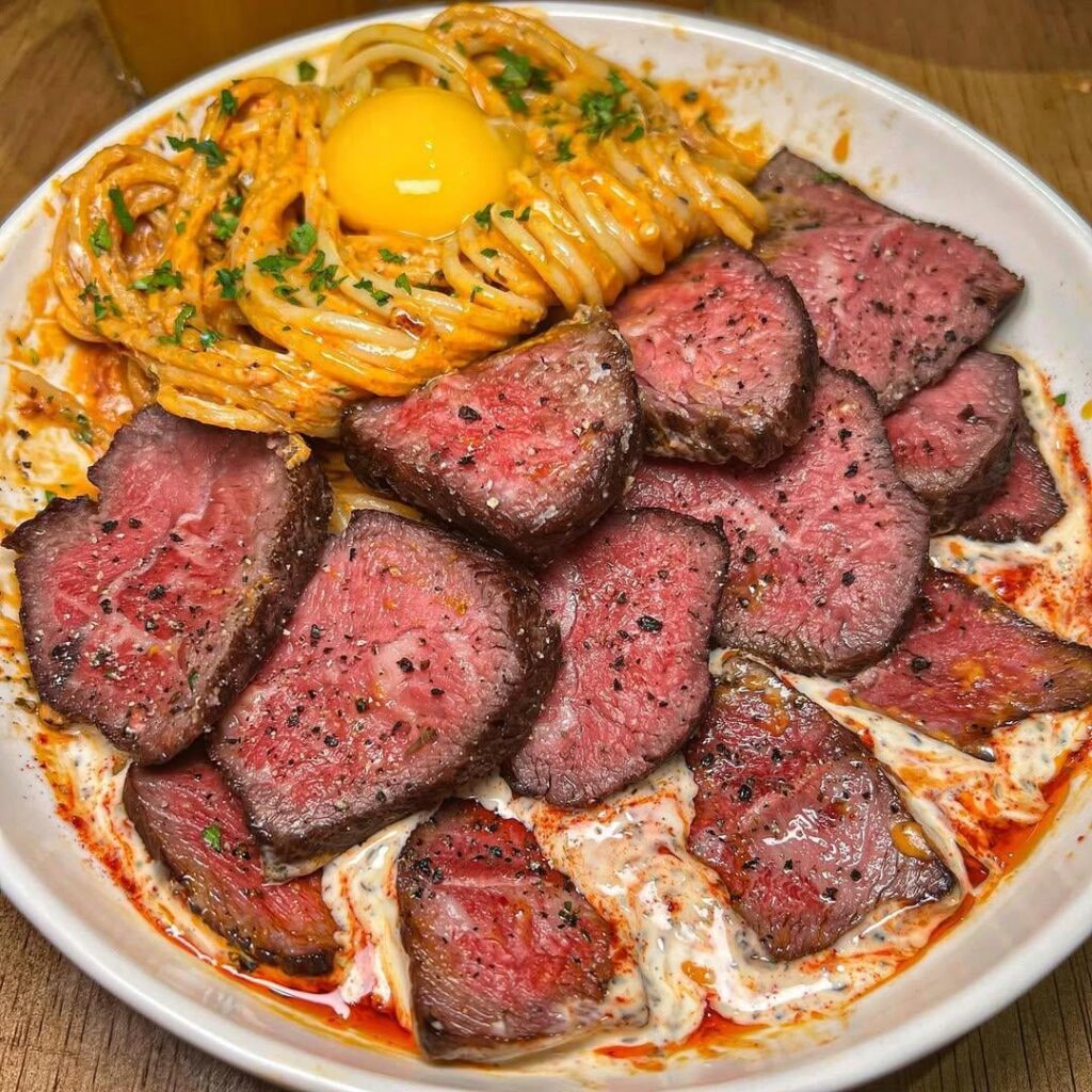 Steak and creamy pasta with a golden yolk. This is heaven.