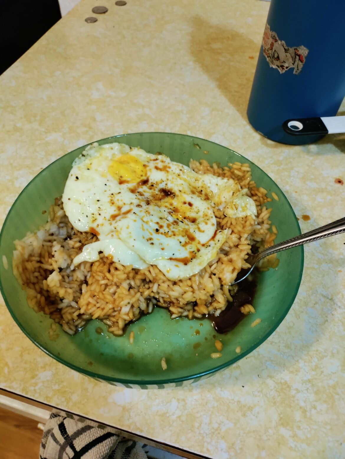 Rice with fried egg and so much soy sauce