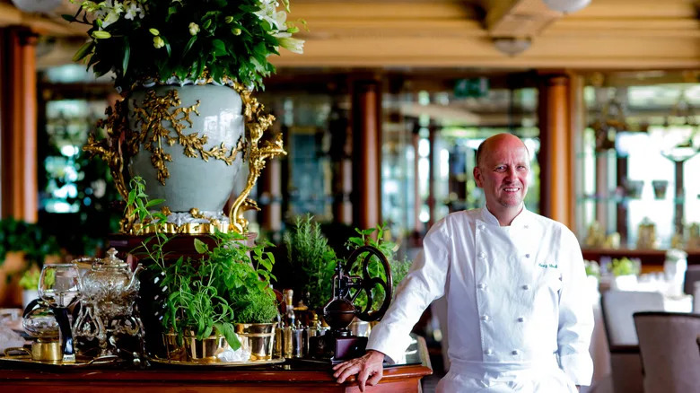 Michelin 3-star chef Heinz Beck poses in the dining room of La Pergola restaurant in Rome, Italy