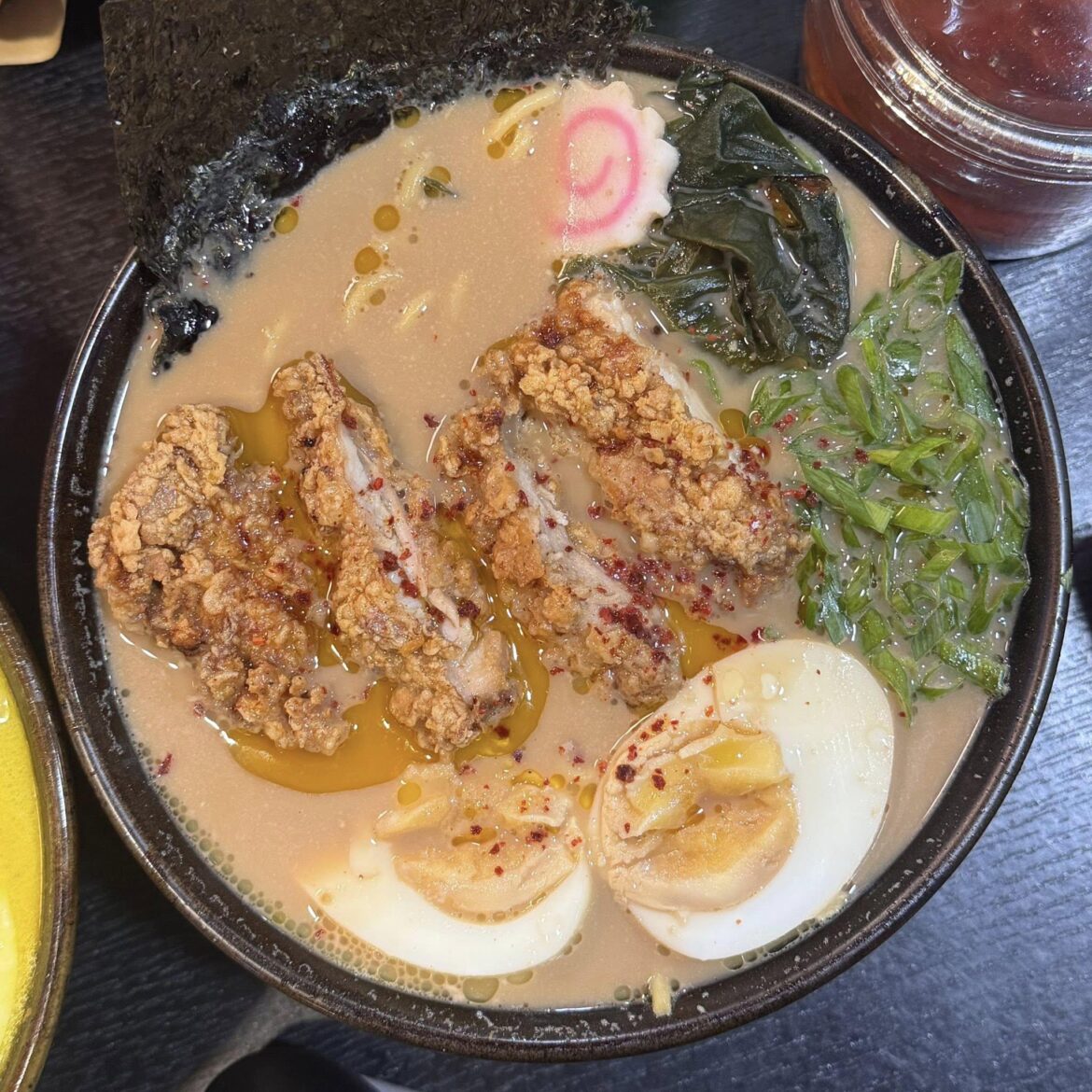 Crispy karaage over rich tonkotsu jammy egg, wakame, scallions, and a kick of chili oil. Comfort in a bowl