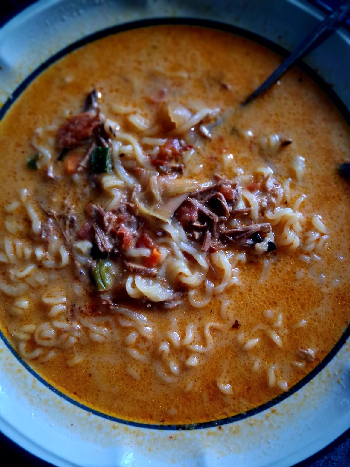 Big bowl of Shin Ramen with leftover pot roast and green onion on this snowy day