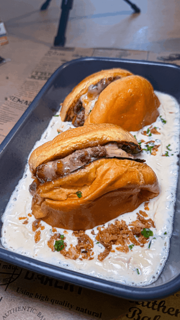 Smash burger drowned in a raclette sauce, the best homemade winter burger I've eaten.