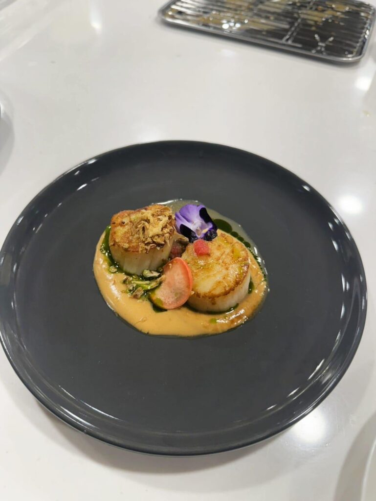 Scallop, sate sauce, chilli pickled radish, basil lemongrass oil, finger lime, fried onion