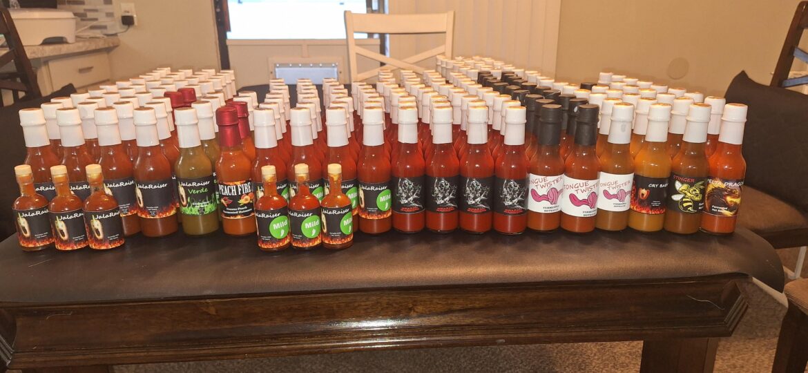 Finally got the rest of this year's hot sauce bottled. All made from peppers from my garden! There's just over 200 bottles left.