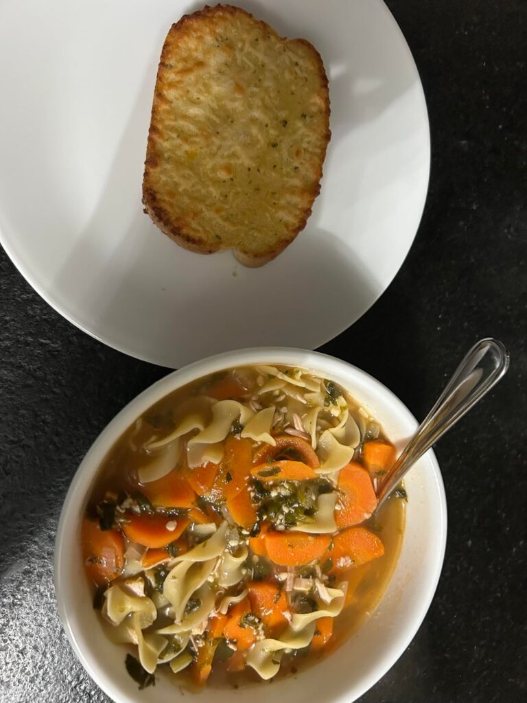 Chicken noodle soup and cheesy garlic bread