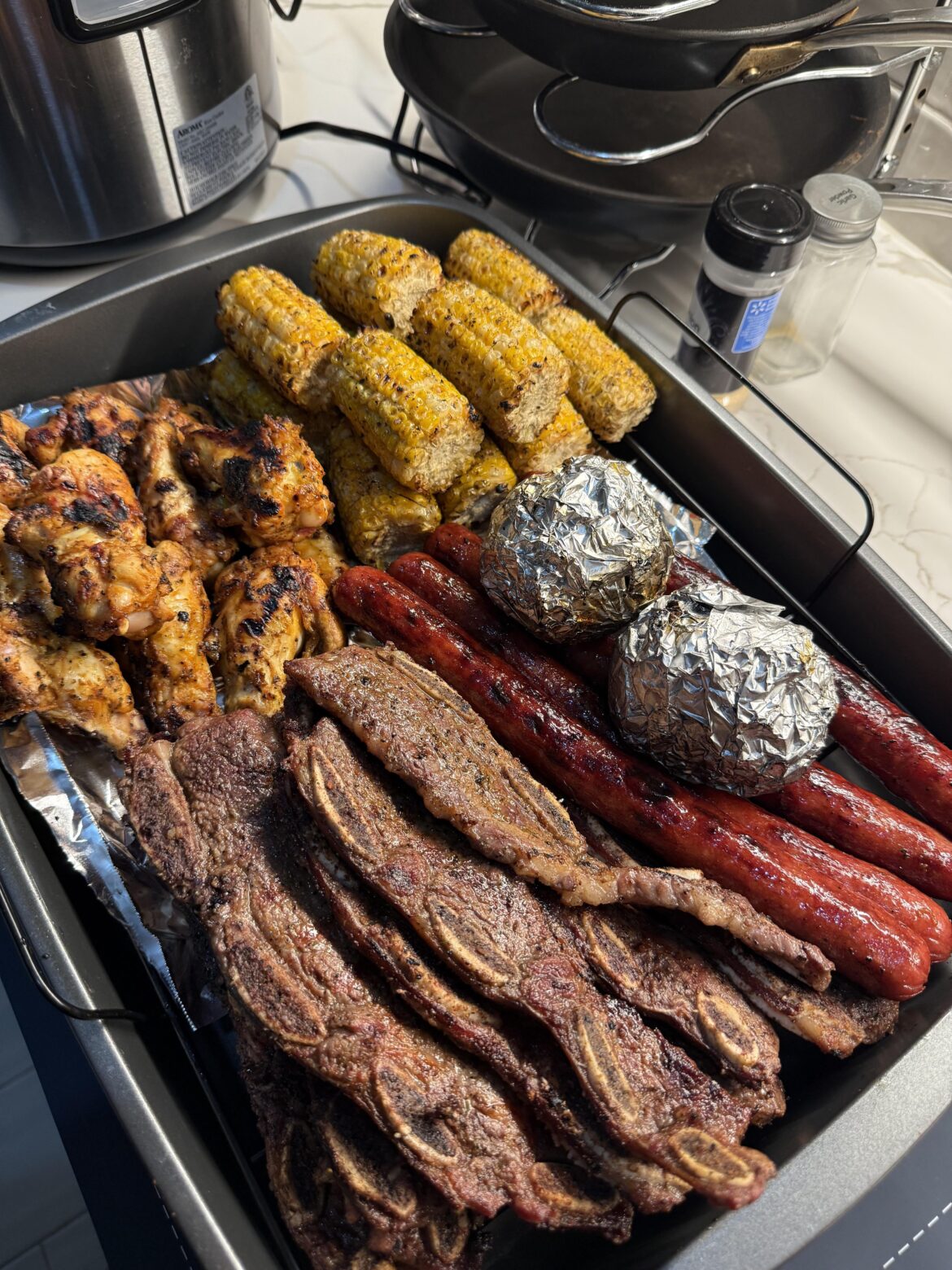 Wings, riblets, sausage, corn, onions