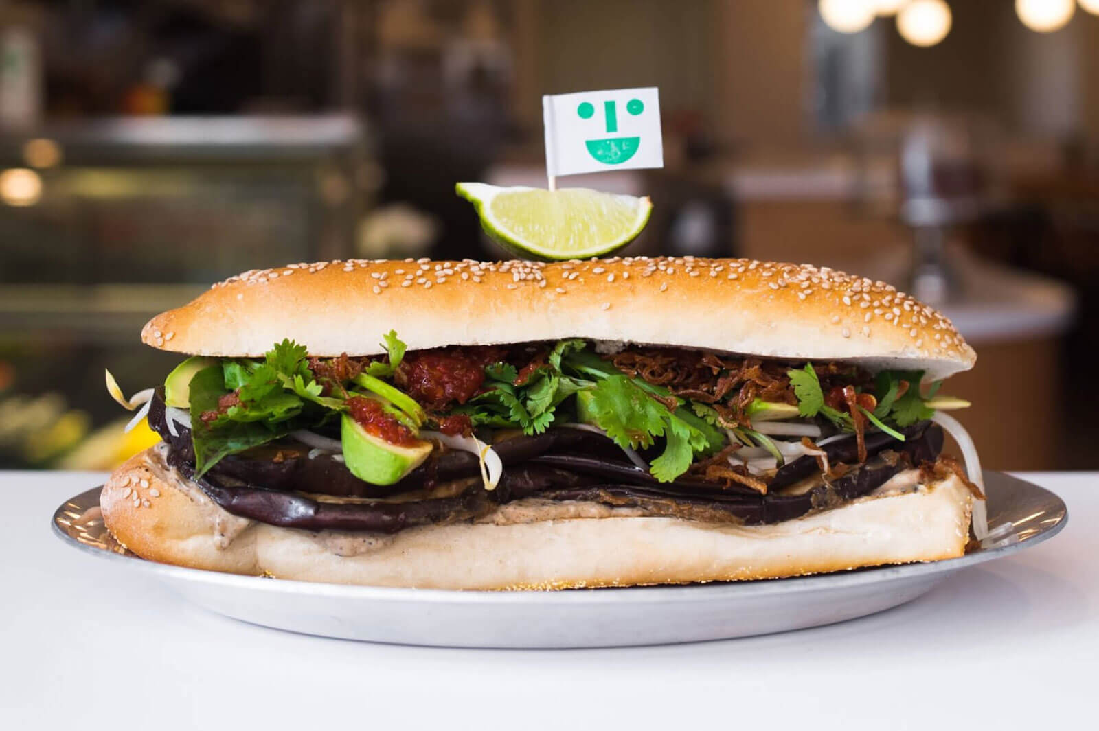 eggplant sub sandwich with toothpick flag with a smiley face