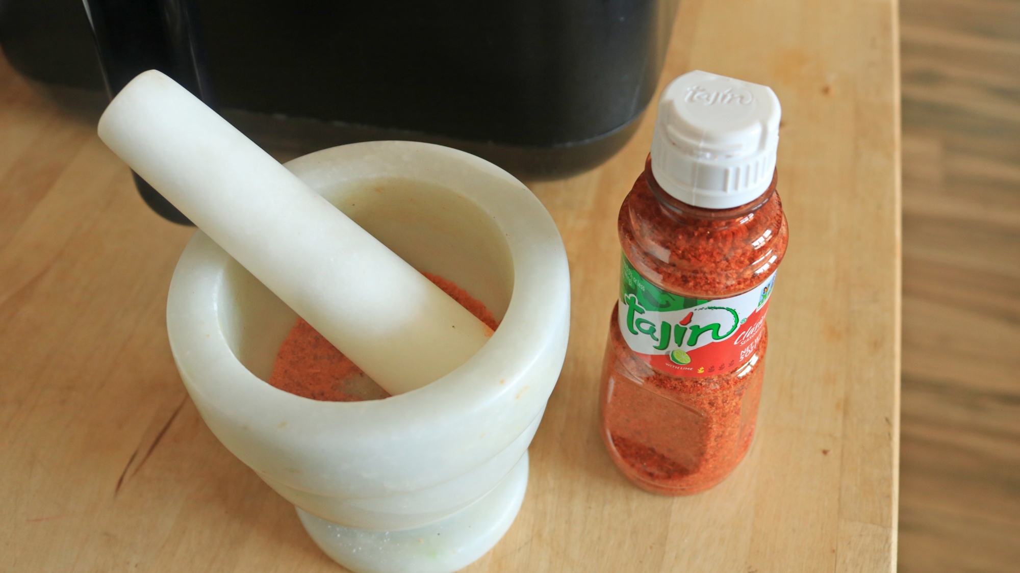 Tajin in a small mortar and pestle.