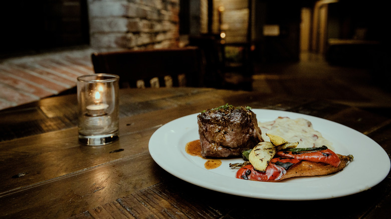 Elegant steak and potatoes meal at fine dining restaurant