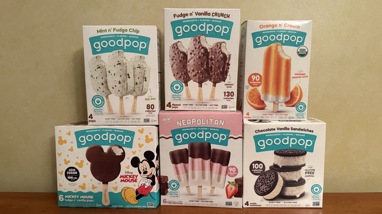 Six boxes of GoodPop dairy-free treats stacked on wooden table