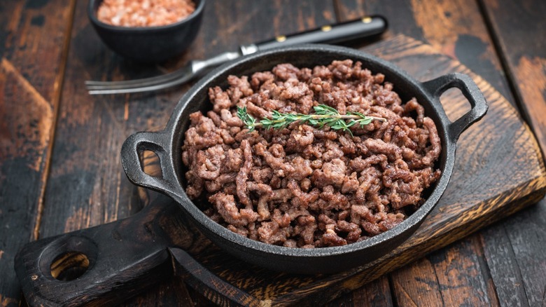 Browned ground beef in a cast iron skillet