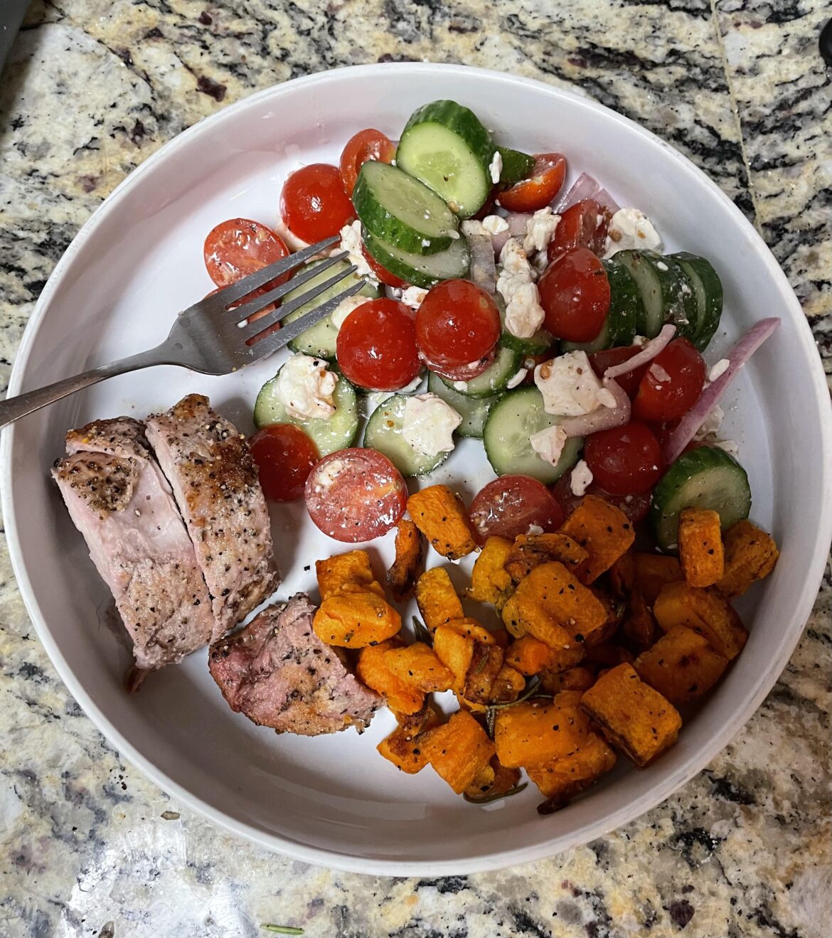 I almost never eat red meat so a bit of pork is a treat. Pork loin, sweet potatoes, modified greek salad.