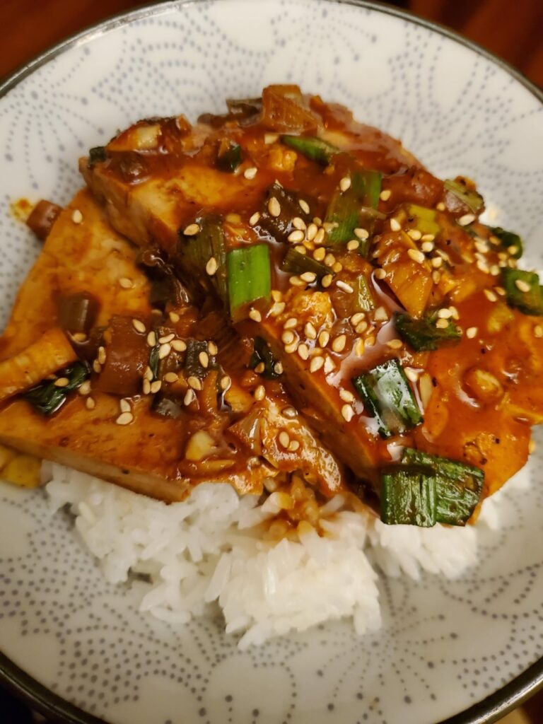 One pan one tofu. Korean spicy soy sauce braised tofu serve over hot rice.