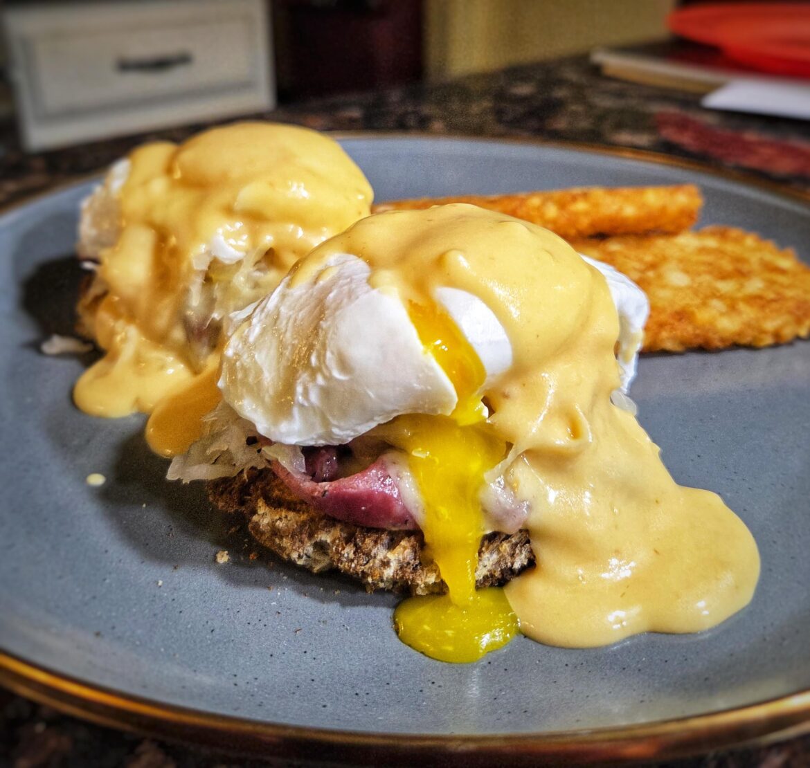 Reuben Benedict. Marbled rye, pastrami, swiss, sauerkraut, and thousand island hollandaise.