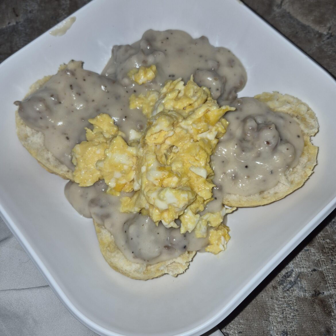 Biscuits with sausage gravy with eggs