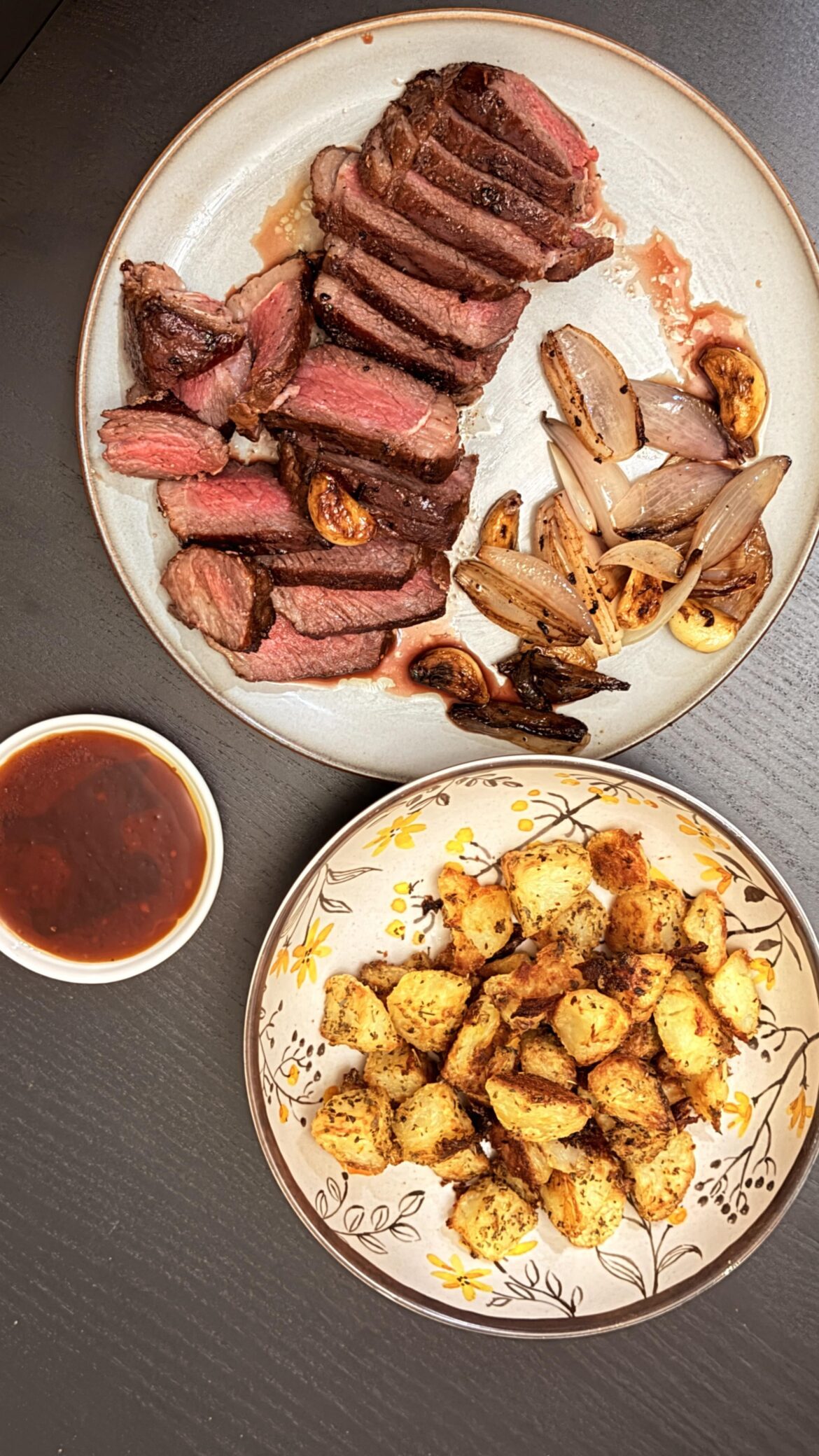 Sichuan peppercorn smoked NY strip with roasted potatoes and sautéed shallots and garlic