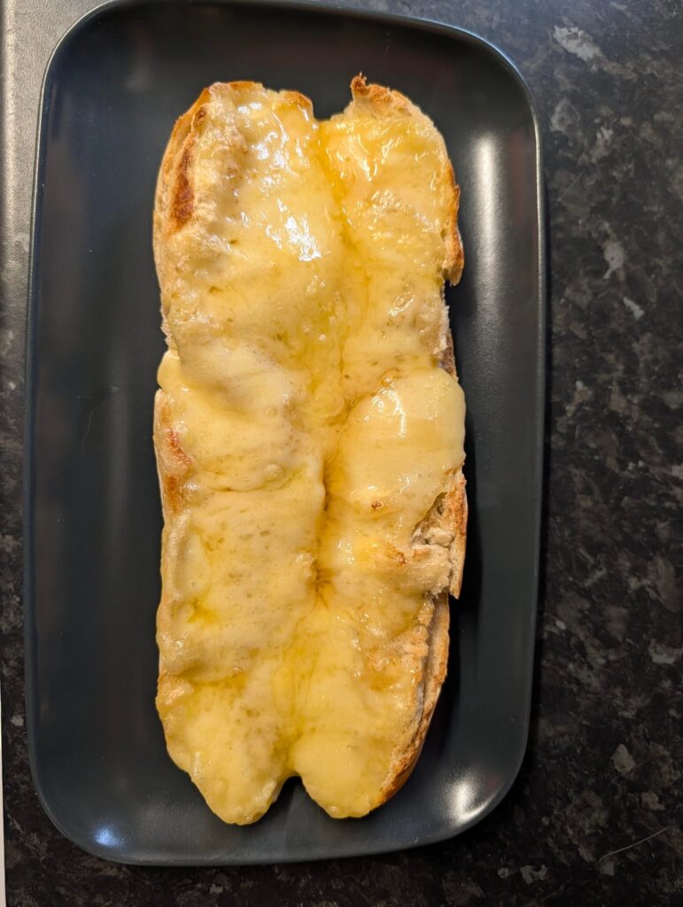 French baguette and melted Comte AOP with honey