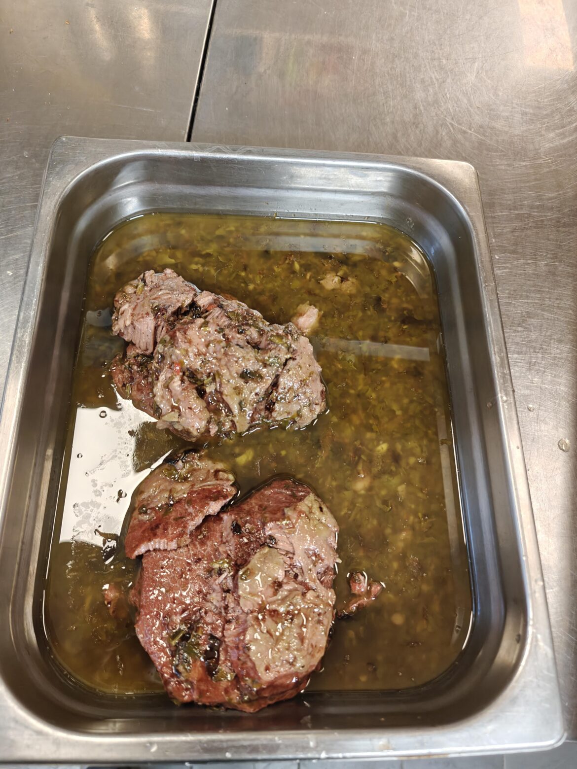Beef cheeks, bag filled with chimichurri