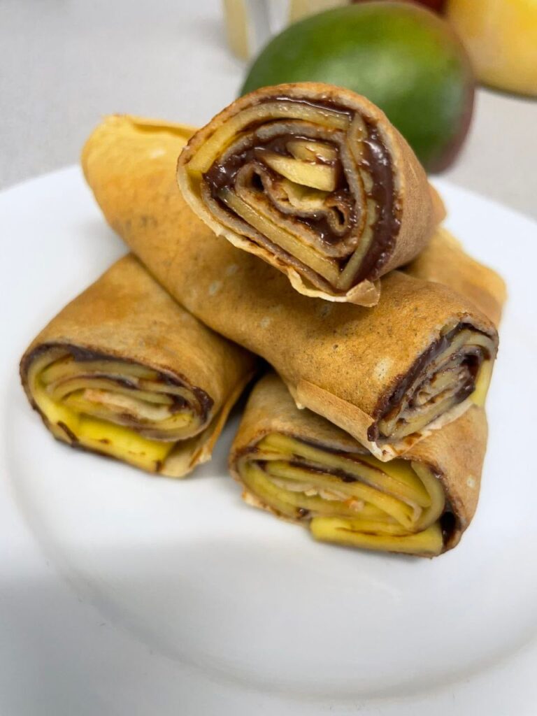 Crêpes filled with mango and a cocoa hazelnut spread.