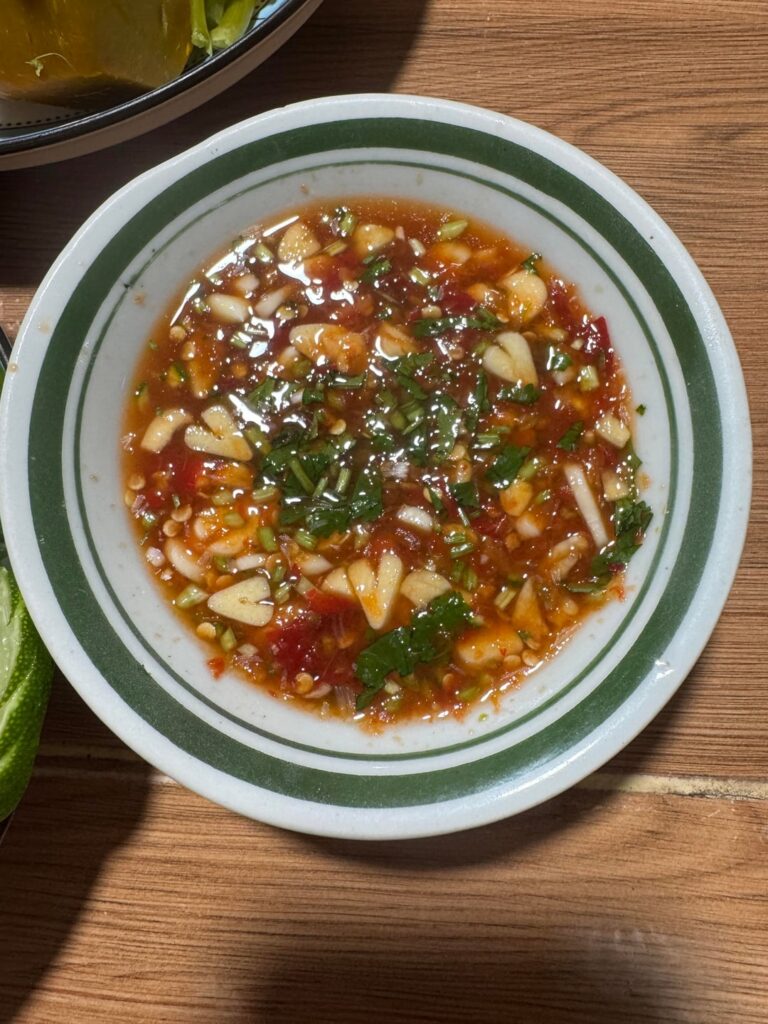 My Thai wife makes garlic hearts in my chili sauce for the steamed fish and squash I had for tonight’s dinner.