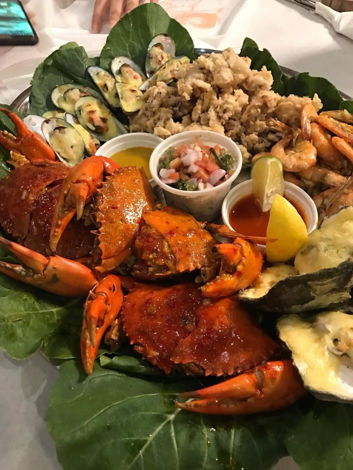 A feast from the sea crabs, shrimp, mussels, and oysters laid out fresh, bold, and ready to be shared