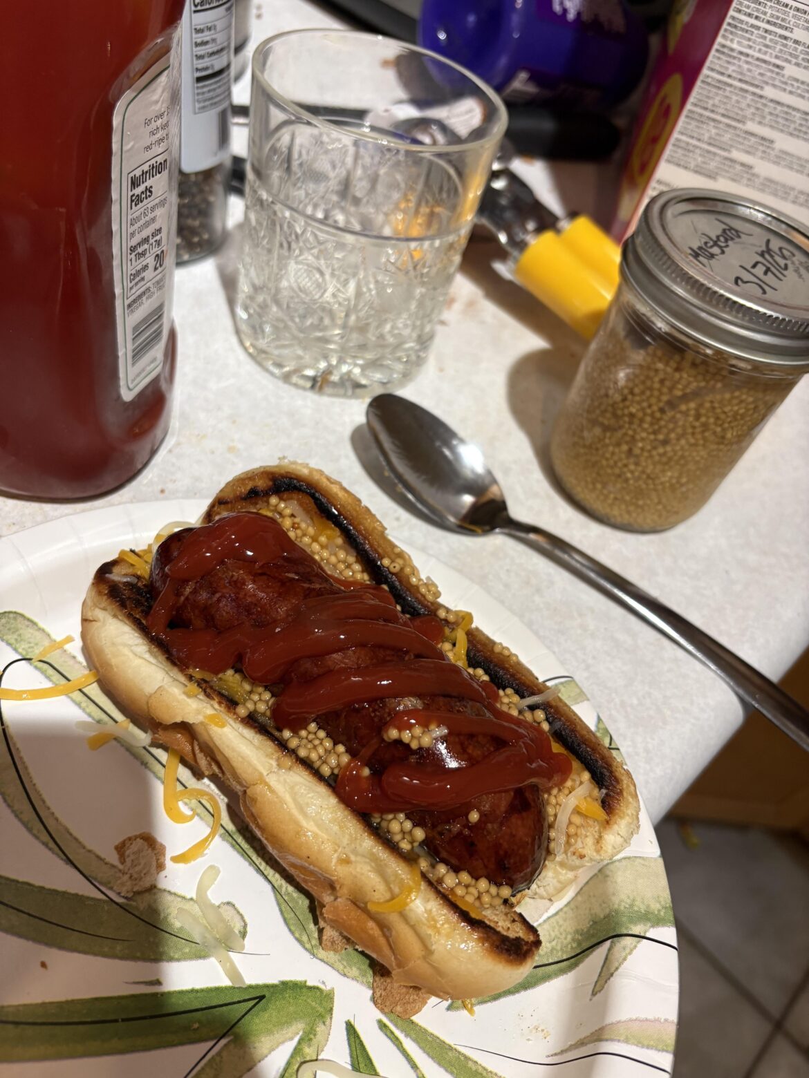 I made a mesquite smoked brat on a toasted bun with shredded cheese, pickled mustard seeds, and ketchup. Wild Turkey 101 is my drink.