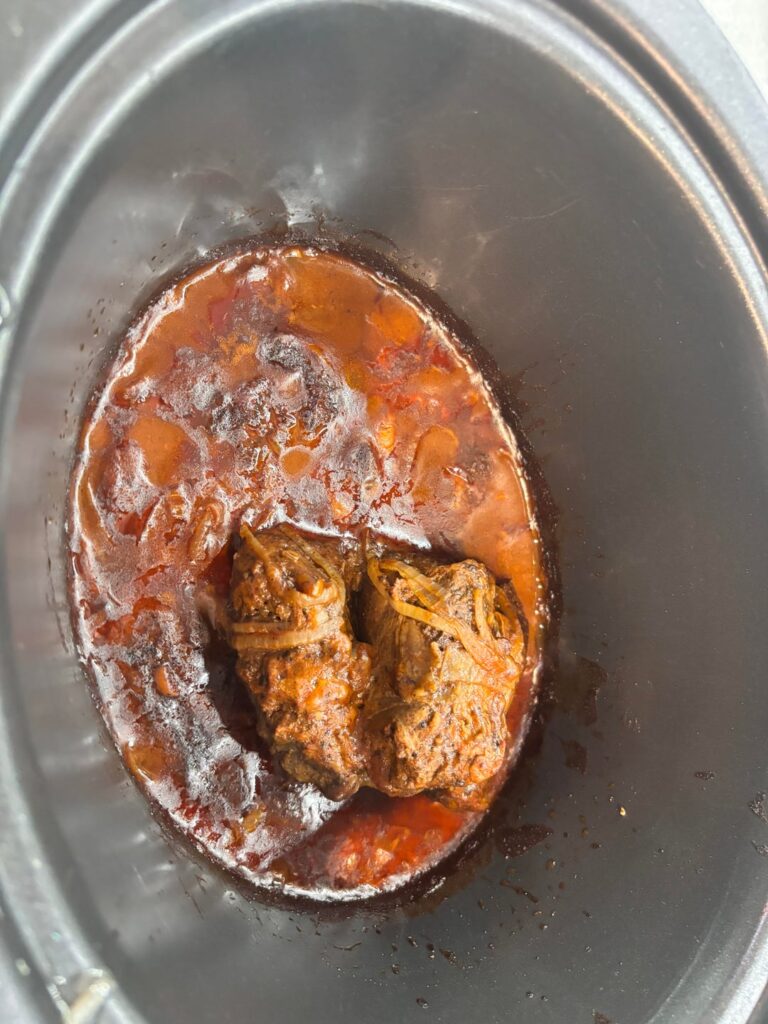 Slow cooker beef shin with mash and a little cabbage.