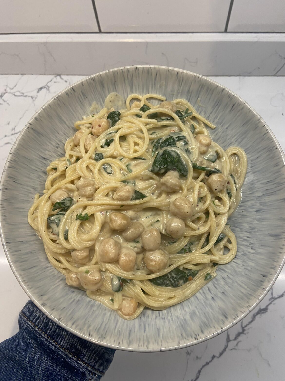Miso cashew cream spaghetti, with lemon zest, chilli flakes, queen chickpeas and spinach