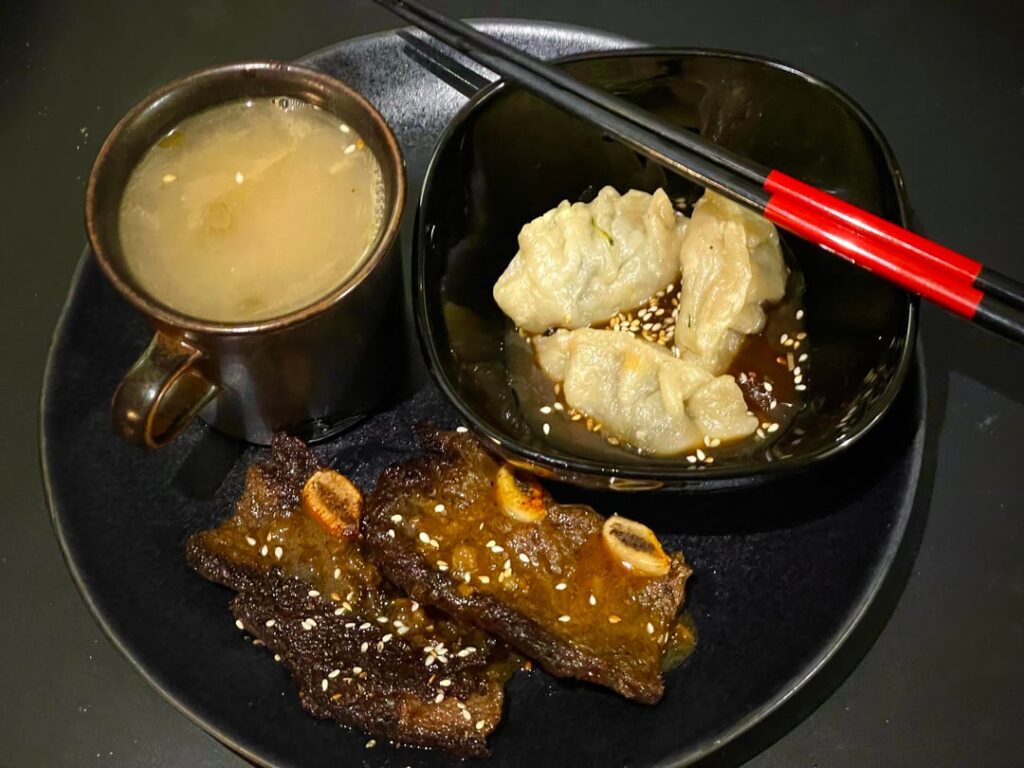 Umami sipping broth, veggie dumplings on a gyoza sauce, and braised short ribs. All from scratch!
