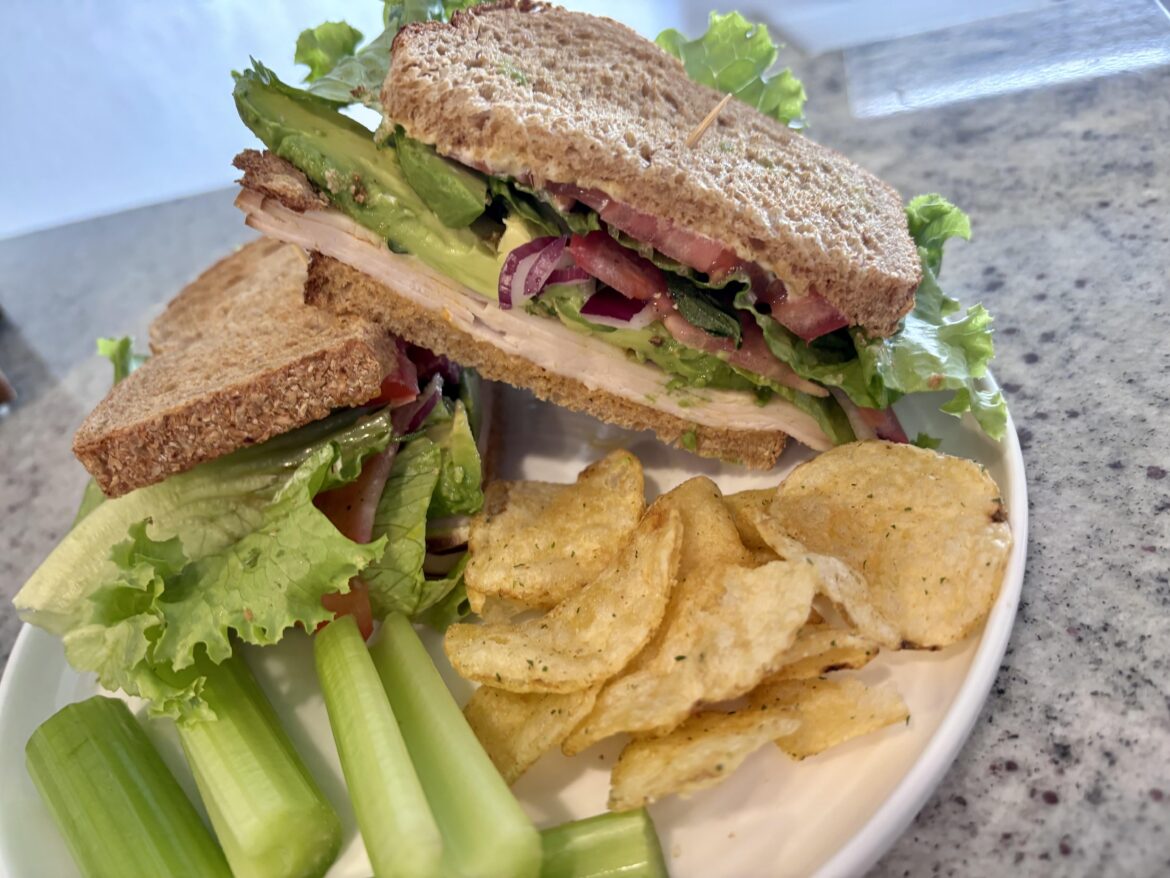 We got ourselves a smoked turkey, avocado, sweet and spicy mustard, red onion, seasoned tomato, fresh oregano, lettuce, pickled Calabrian chili peppers, and kewpie mayo sandwich on wheat!