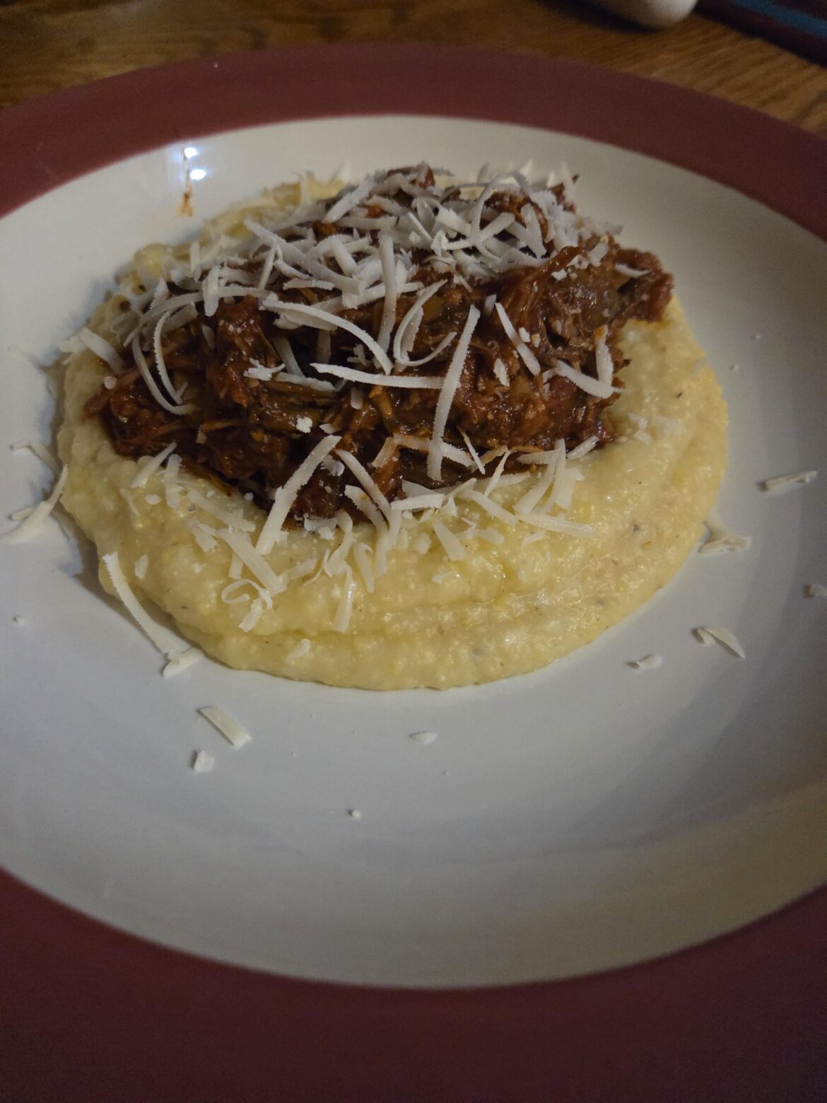 Braised pork and Mushrooms in a tomato based sauce  over polenta