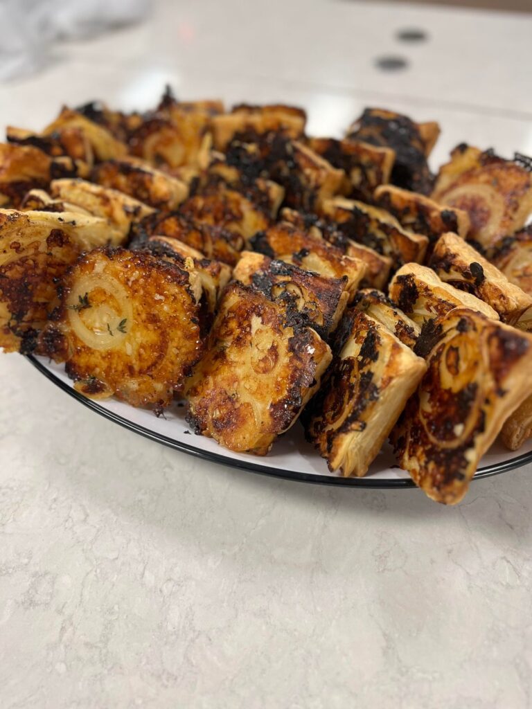 Onion and gruyerre puff pastries with thyme and hot honey