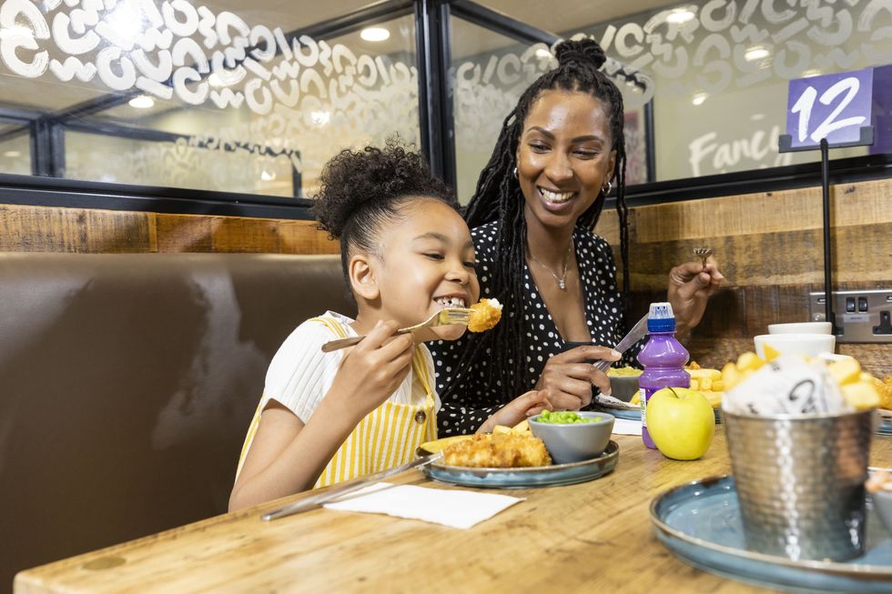 Mum and daughter eating at Morrisons