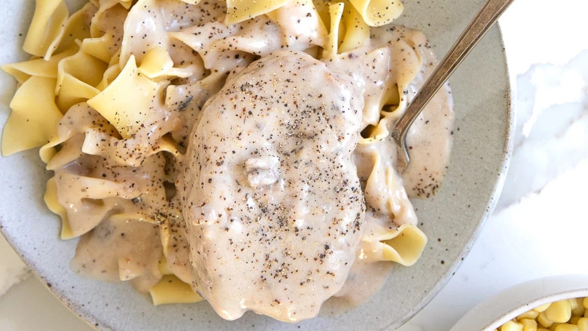 Cream of mushroom soup smothered pork chop on noodles.