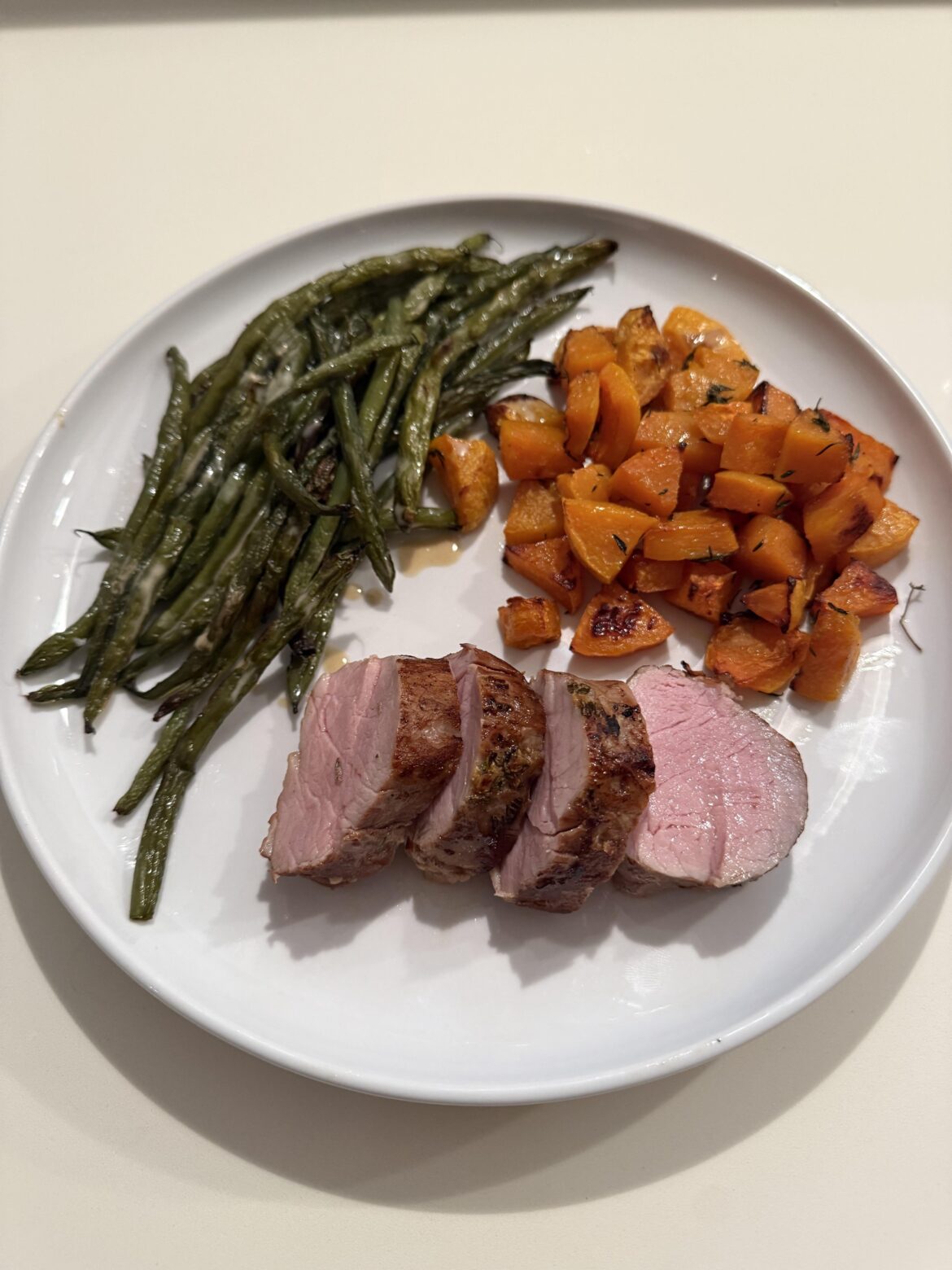 It’s been a while since I made a pork tenderloin. This one was flavored with garlic, olive oil, lemon zest, fresh thyme, and rosemary.