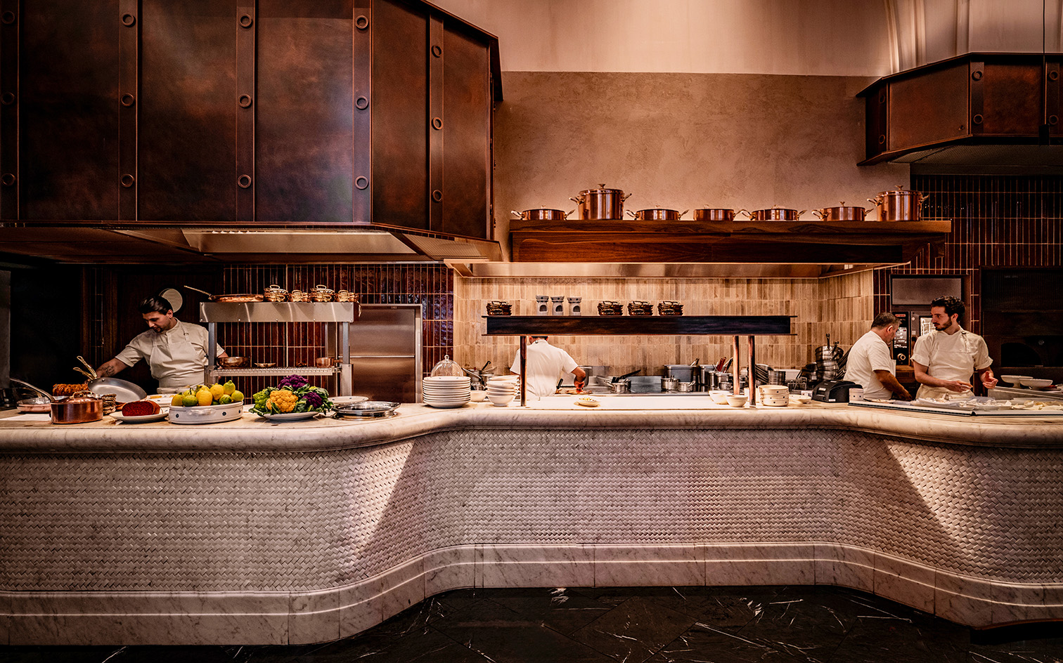 interior of Mezzogiorno by Afroditi in moody light and warm red and brown tones