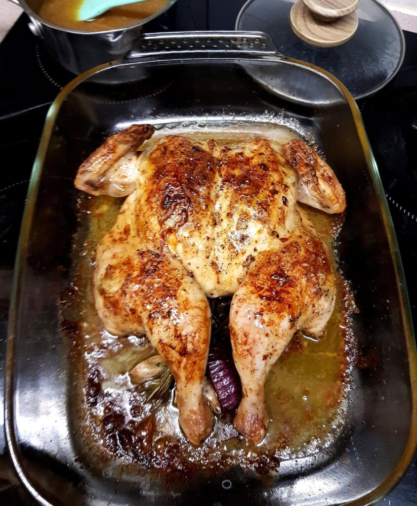 Spatchcock Roast Chicken with Tarragon Butter, Roast Potatoes, Tenderstem Broccoli, Sautéed Garlic Green Beans, Cauliflower Three Cheese and Cabbage. White Wine Tarragon Gravy.