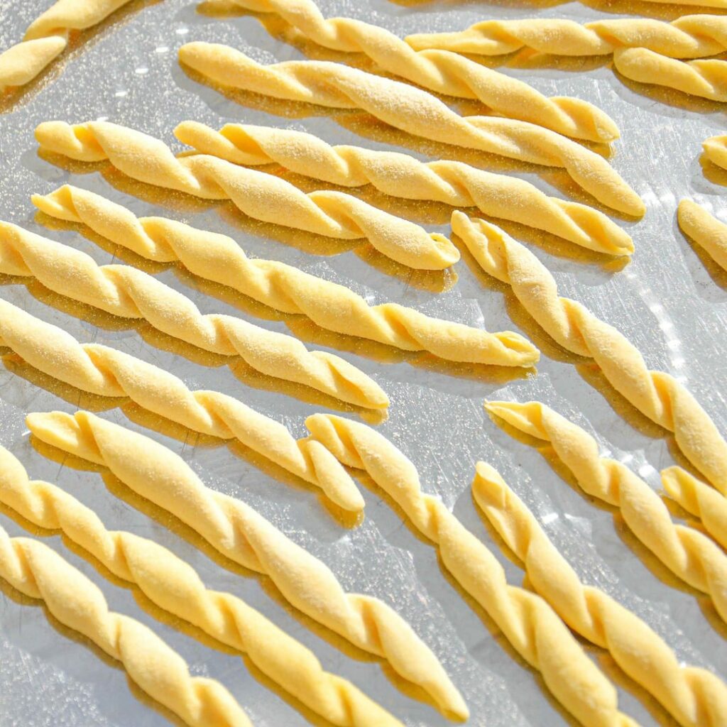 Fileja: a Calabrian spiral pasta served with spicy ’nduja tomato sauce with aubergine & red onion