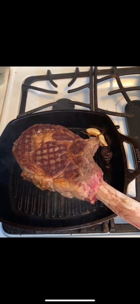 Tomahawk with a black garlic butter