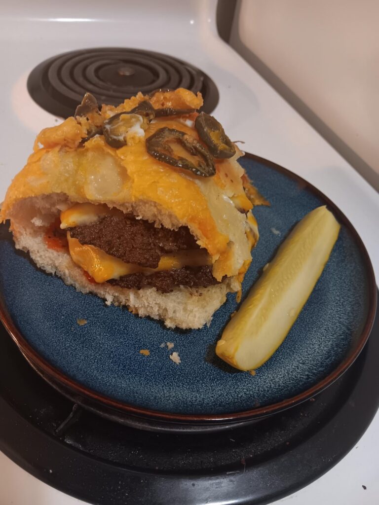Double cheeseburger on a jalapeño cheddar loaf