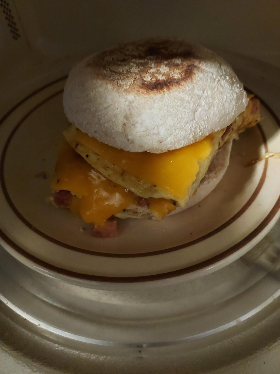 egg ham and cheese on English muffin