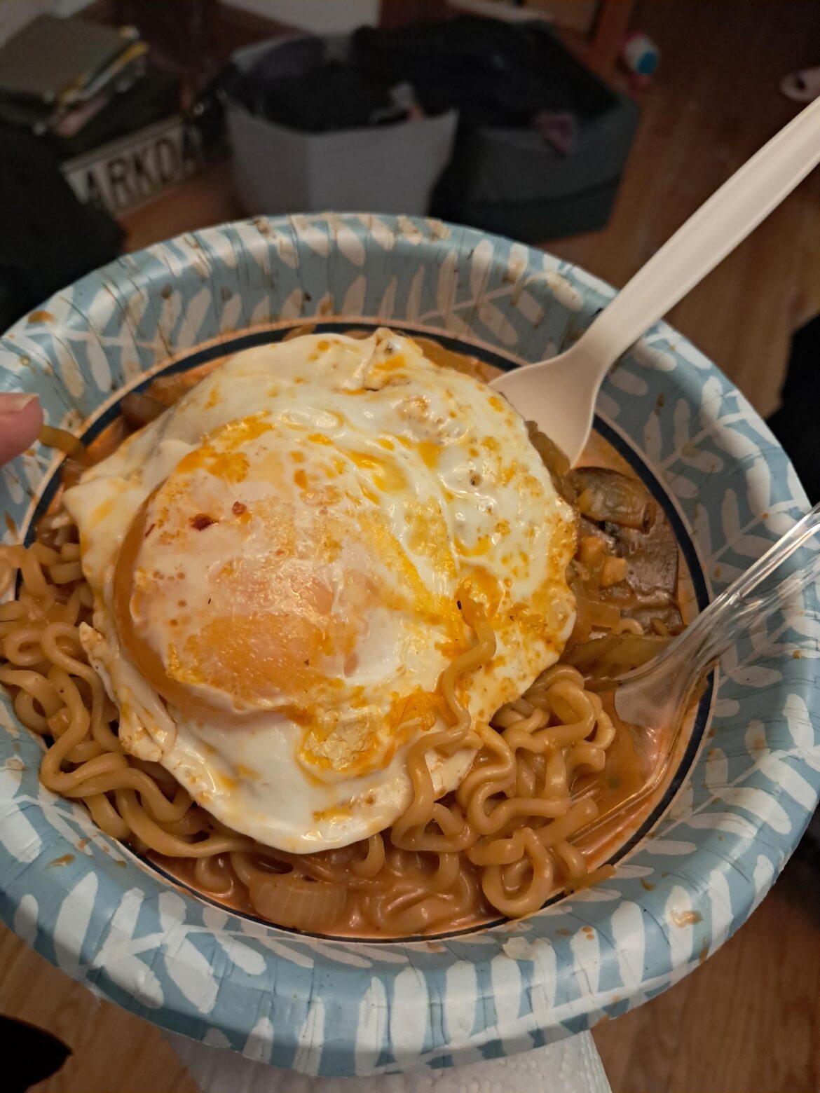 Put a fried egg on Buldak with grilled onions, mushrooms & garlic