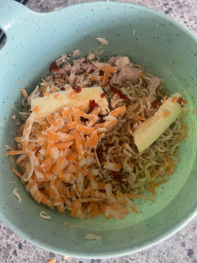 Ramen with cheese and butter n tuna and spices and scorpion sauce