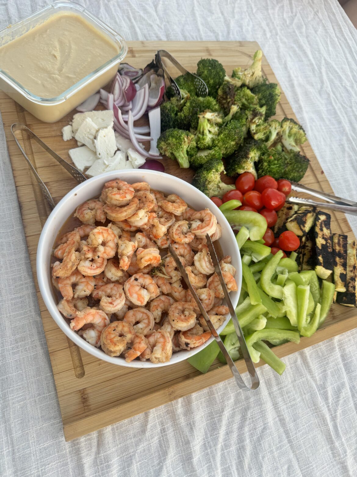 Raw and roasted vegetables, shrimp, feta cheese and hummus.