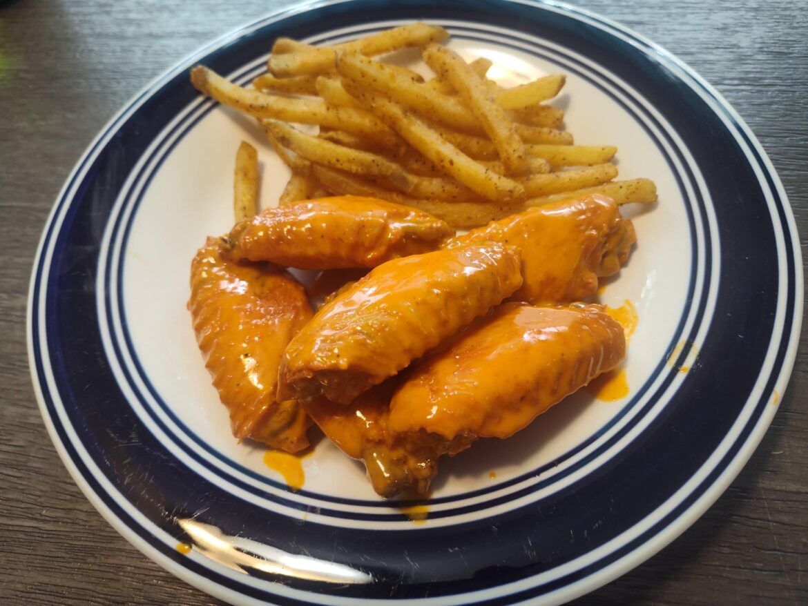 Spicy chicken wings and fries